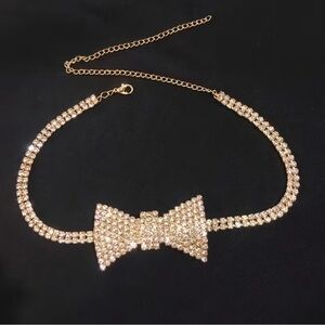 Dazzling crystal bow centerpiece on a sparkling choker. Elegant, eye-catching.